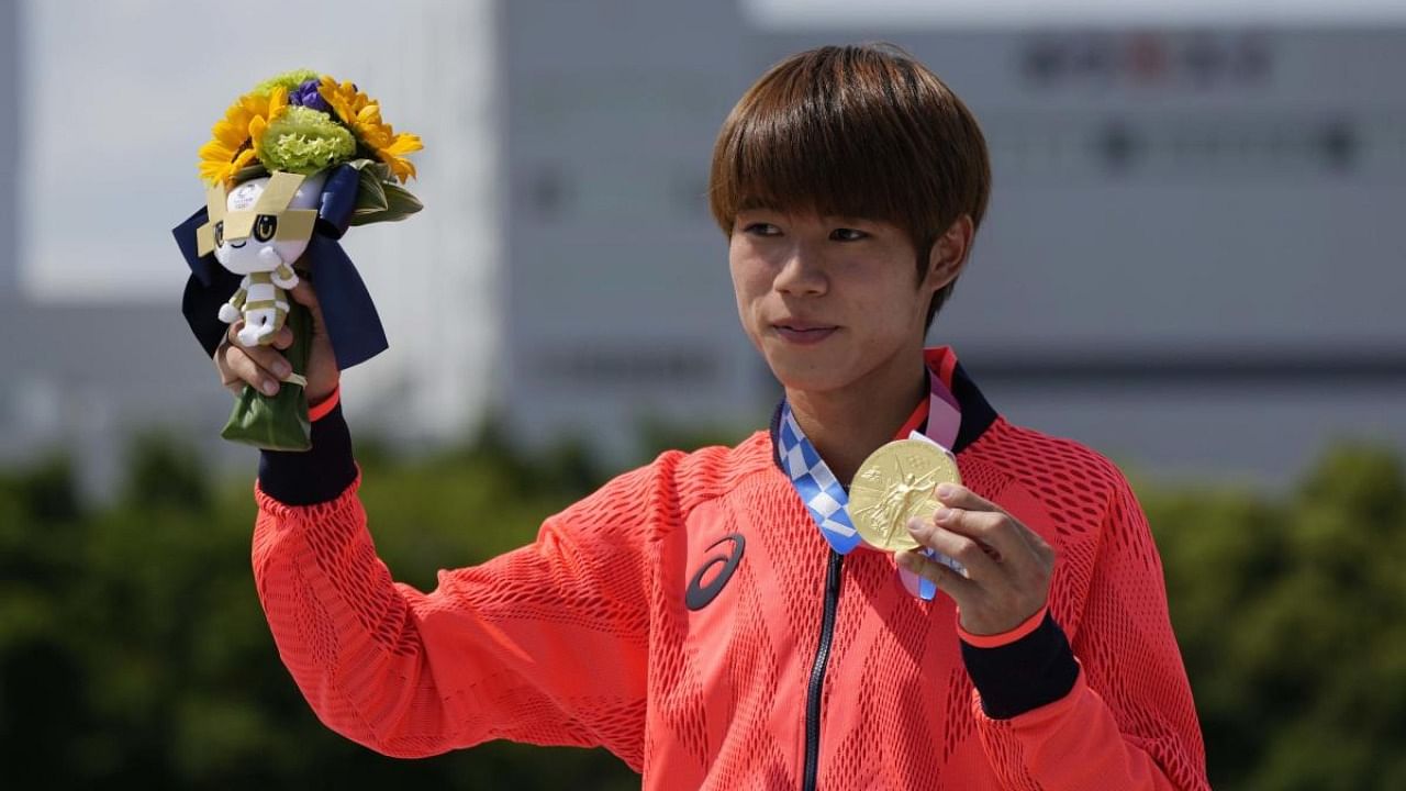 Yuto Horigome of Japan holds his gold medal after the men's street skateboarding finals at the 2020 Summer Olympics, Sunday, July 25, 2021, in Tokyo, Japan. Credit: AP/PTI Photo