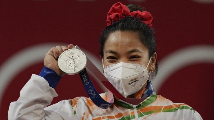 Mirabai Chanu with her medal. Credit: PTI Photo