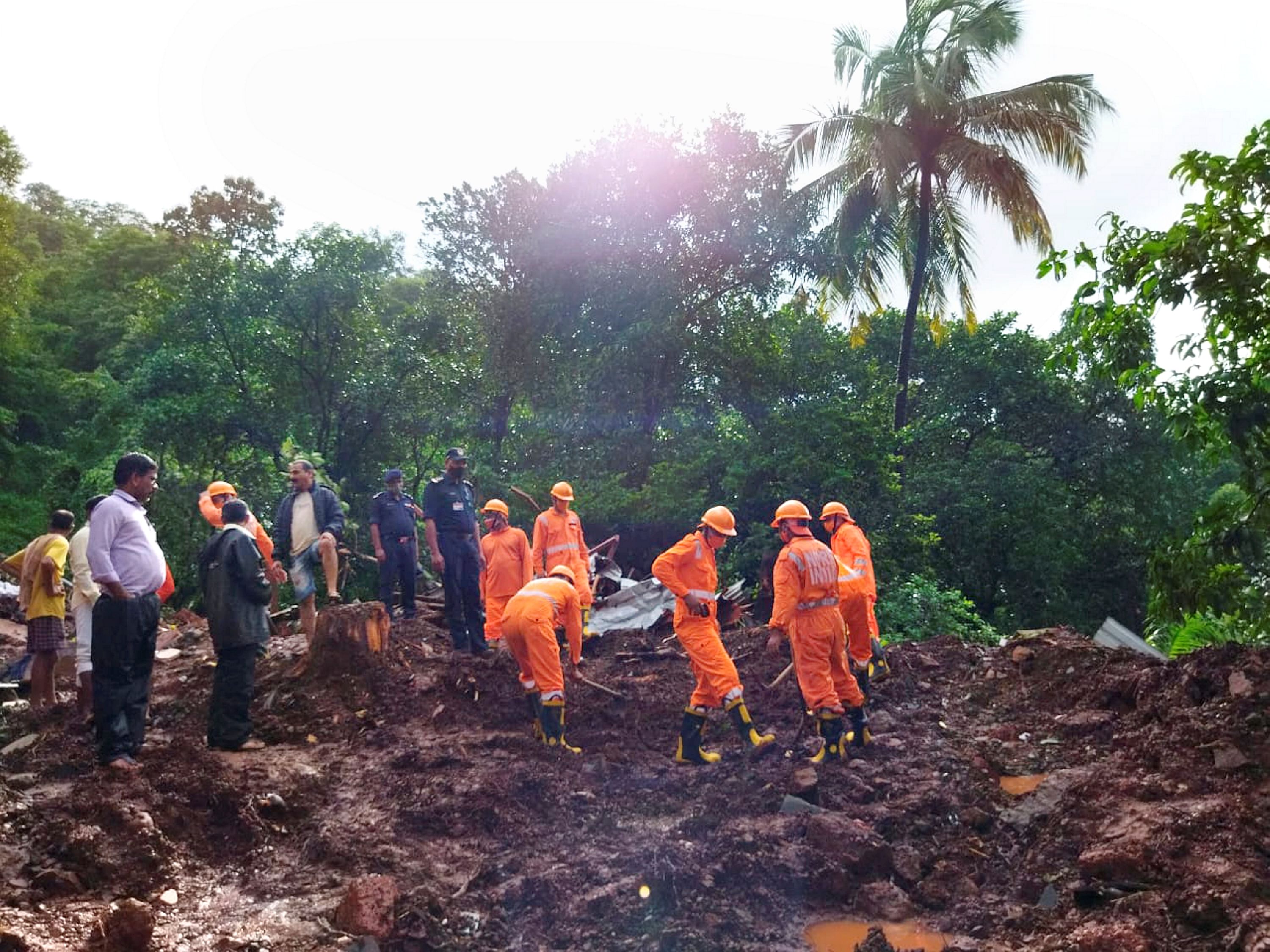 NDRF personnel carry out a rescue operation in a flood affected area in Ratnagiri district. Credit: PTI Photo