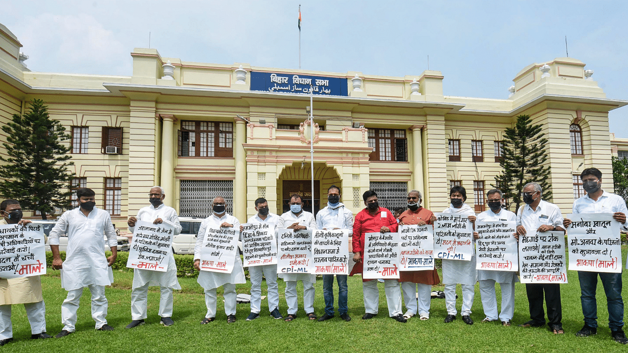 CPI-ML legislators holding placards stage a protest during the Monsoon Session at Bihar Legislative Council, in Patna. Credit: PTI Photo