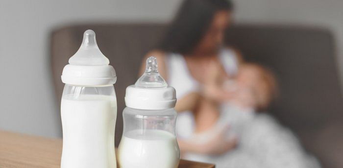 Before breastfeeding the newborn, she should wash her hands, wear protective gear such as a mask, face shield. Credit: iStock Photo