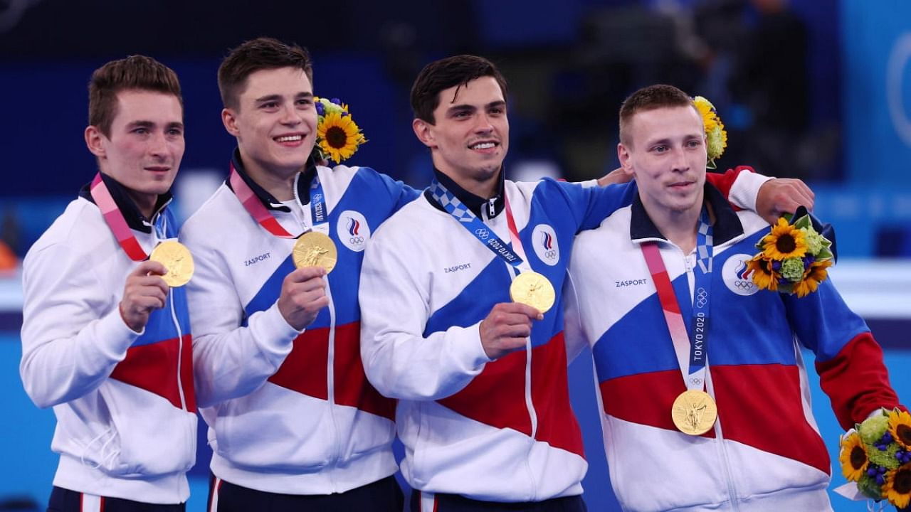Gold medallist's Artur Dalaloyan of the Russian Olympic Committee, David Belyavskiy of the Russian Olympic Committee, Denis Abliazin of the Russian Olympic Committee and Nikita Nagornyy of the Russian Olympic Committee celebrate on the podium. Credit: Reuters Photo