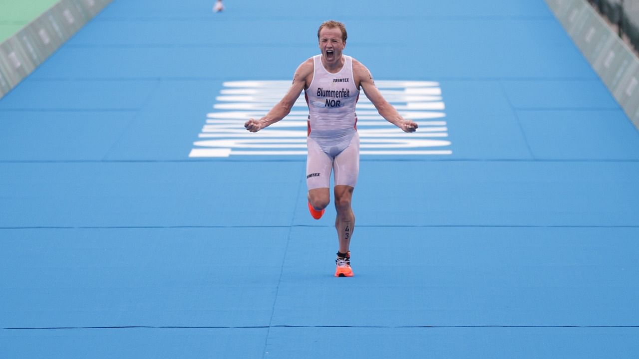 Kristian Blummenfelt of Norway celebrates after winning the gold. Credit: Reuters photo