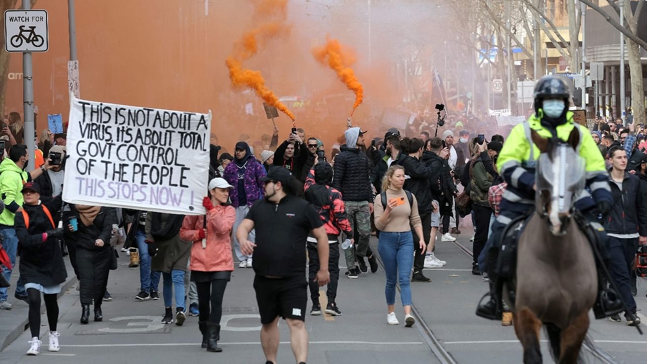 Protesters march down a street during a rally Melbourne on July 24, 2021 to demonstrate against the city's restrictions due to Covid-19. Credit: AFP file photo