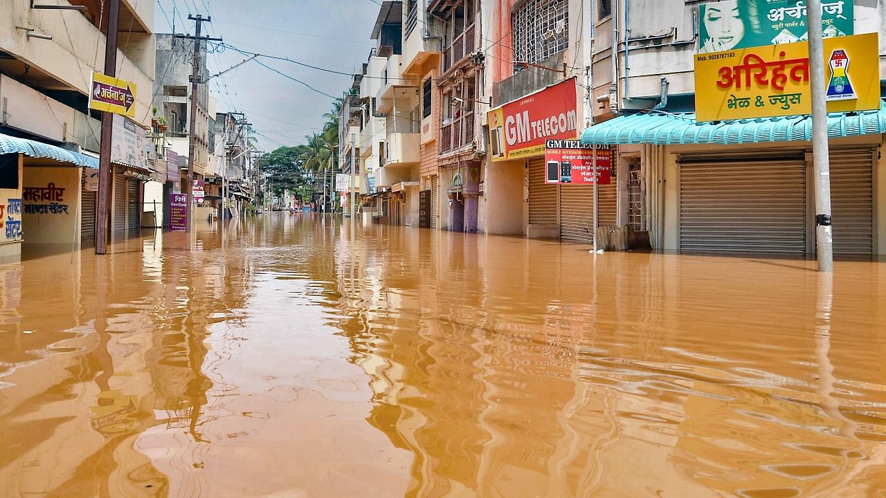 A view of submerged old Sangli area after Koyana dam water discharged as Krishna river level rises following rainfall, in Sangli, Sunday, July 25, 2021. Credit: PTI Photo