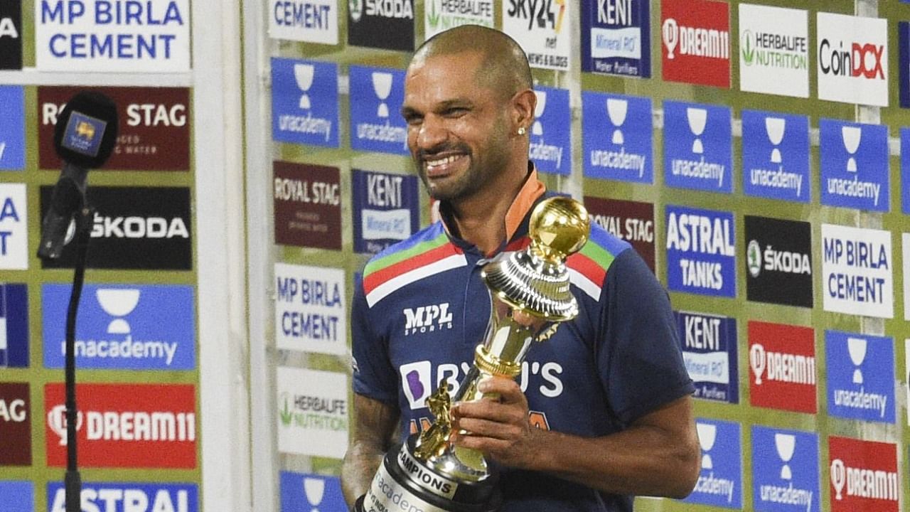 Shikhar Dhawan poses with the trophy after their win over Sri Lanka in the third one-day international (ODI) cricket match between Sri Lanka and India at the R.Premadasa Stadium in Colombo. Credit: AFP Photo