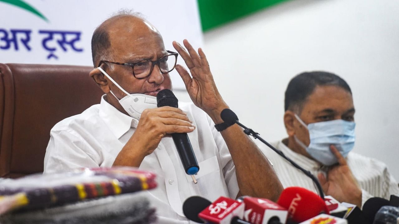 Nationalist Congress Party chief Sharad Pawar along with Maharashtra Home Minister Dilip Wales Patil during a press conference regarding relief material sent to the flood affected areas, in Mumbai. Credit: PTI Photo