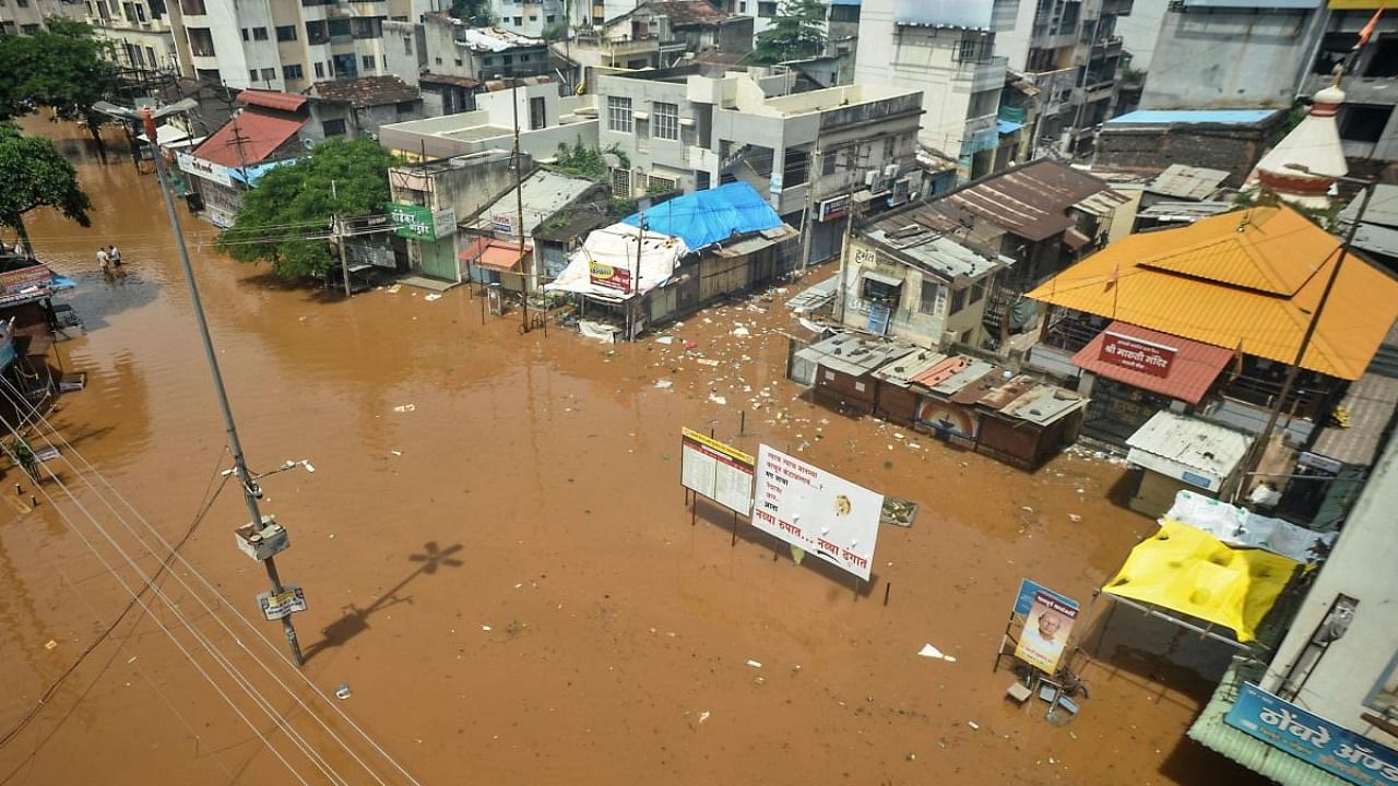 A general view of a flooded square is pictured following heavy monsoon rains at Sangli district of Maharashtra on July 26, 2021, as the death toll from monsoon-triggered landslides and floods climbed to 207. Credit: AFP Photo