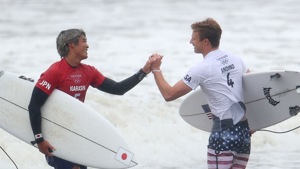 Kanoa Igarashi of Japan shakes hands with Kolohe Andino of the United States after competing in Heat 1. Credit: Reuters photo