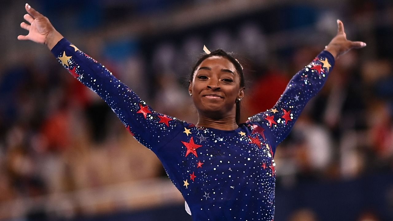 Simone Biles reacts after competing in the artistic gymnastics balance beam event of the women's qualification during the Tokyo 2020 Olympic Games at the Ariake Gymnastics Centre in Tokyo. Creidt: AFP Photo
