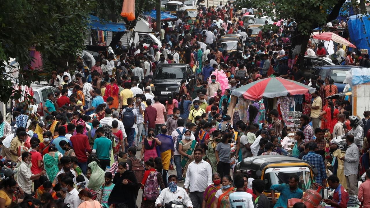 People are seen at a crowded market amidst the spread of the coronavirus in Mumbai, India, July 28, 2021. Credit: Reuters Photo