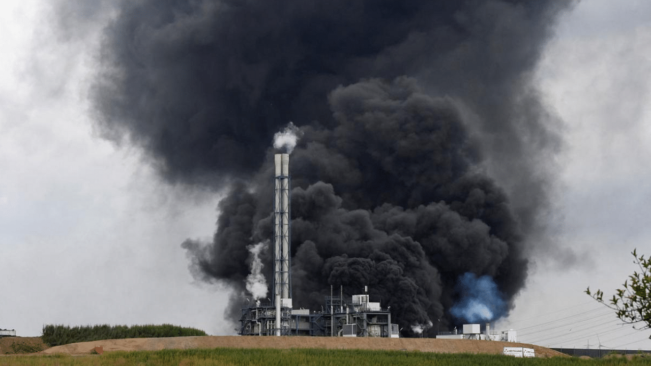 Smoke rises from a landfill and waste incineration area at the Chempark industrial park run by operator Currenta following an explosion in Leverkusen's Buerrig district, western Germany. Credit: AFP Photo
