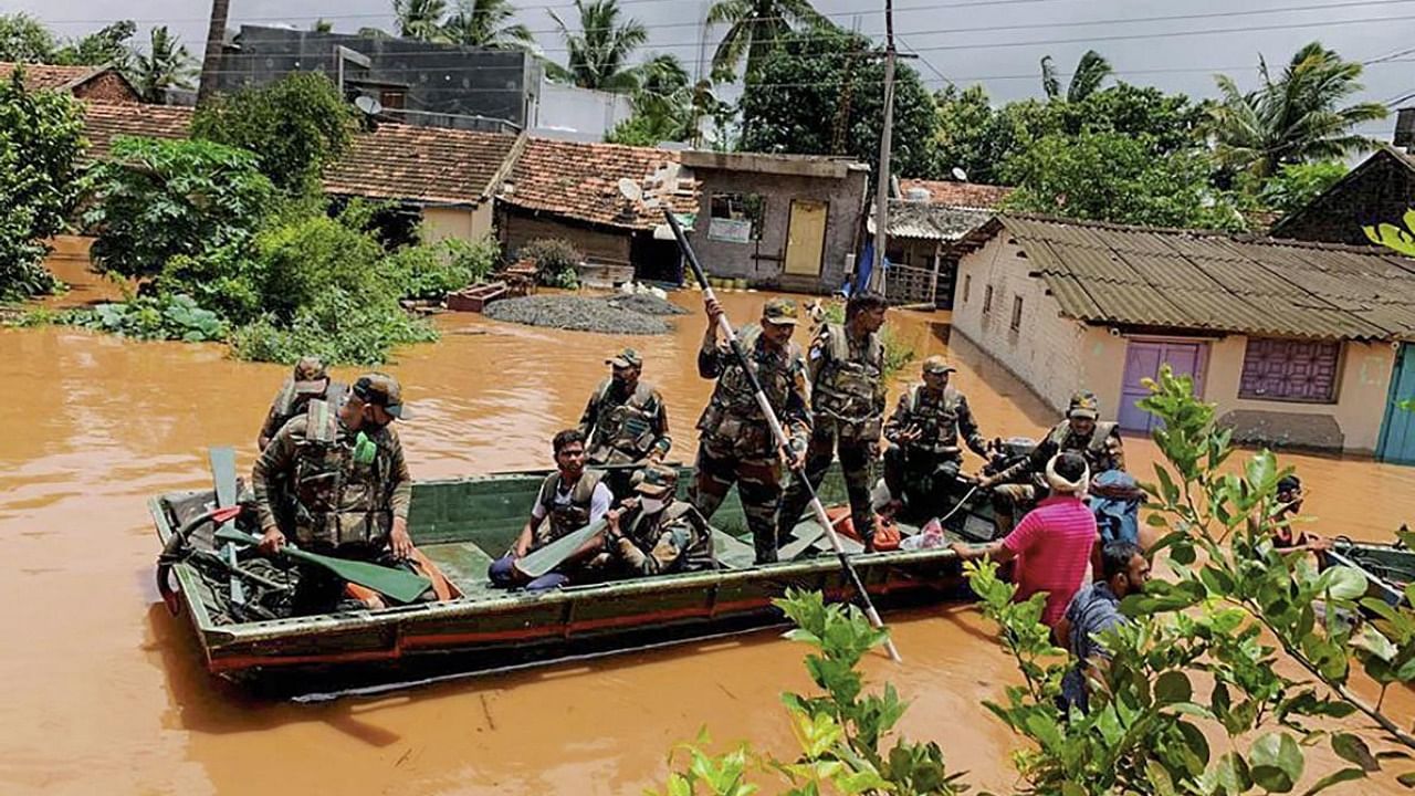 Army personnel during a rescue operation at a flooded area after rain in Kolhapur. Credit: PTI Photo