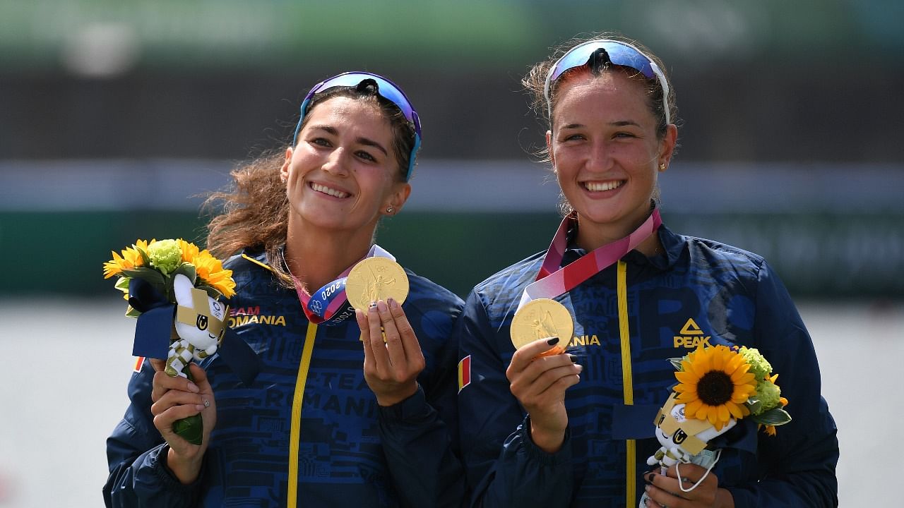 Gold medallists Ancuta Bodnar of Romania and Simona-Geanina Radis of Romania celebrate with their medals. Credit: Reuters photo