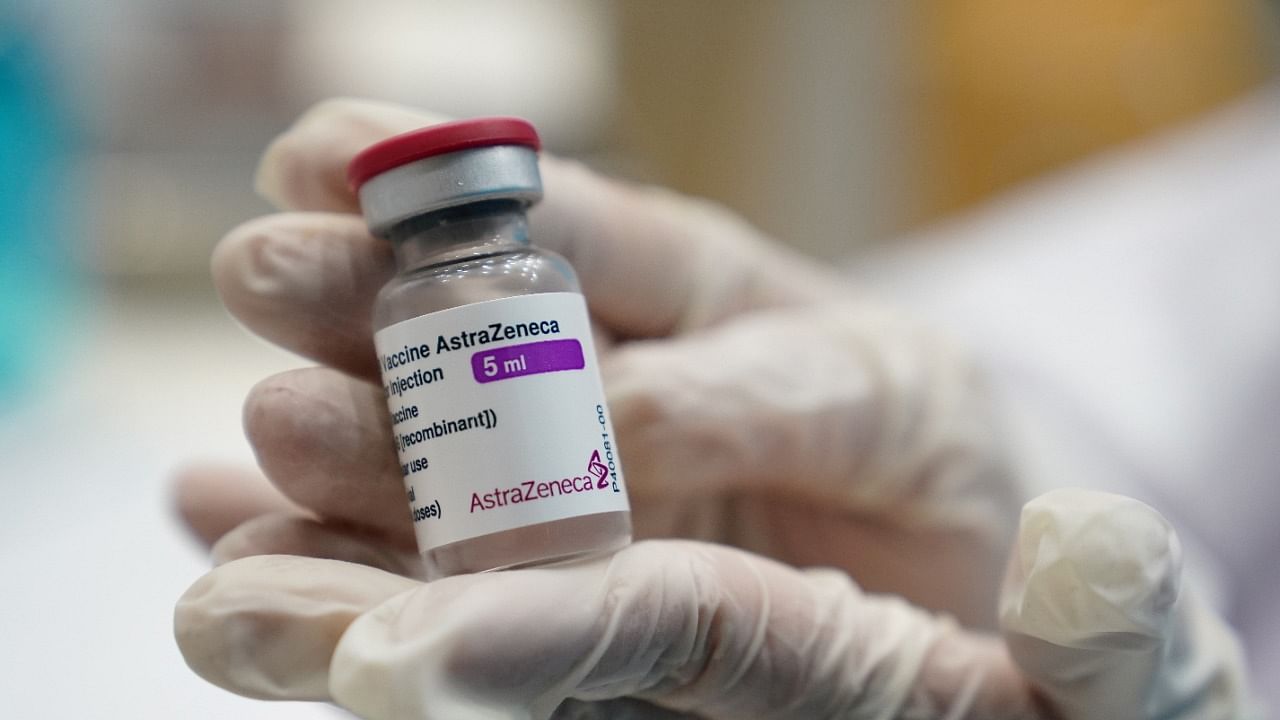 A health worker shows a vial of the AstraZeneca vaccine. Credit: Reuters Photo