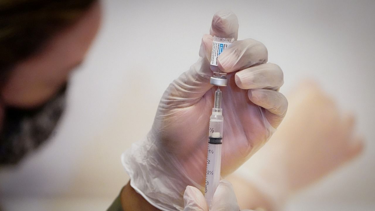  A healthcare worker prepares a dose of the Johnson & Johnson Covid-19 vaccine. Credit: Reuters File Photo