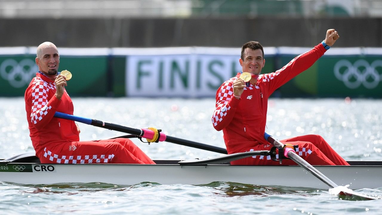 Gold medallists Martin Sinkovic of Croatia and Valent Sinkovic of Croatia celebrate in their boat with their medals. Credit: Reuters Photo