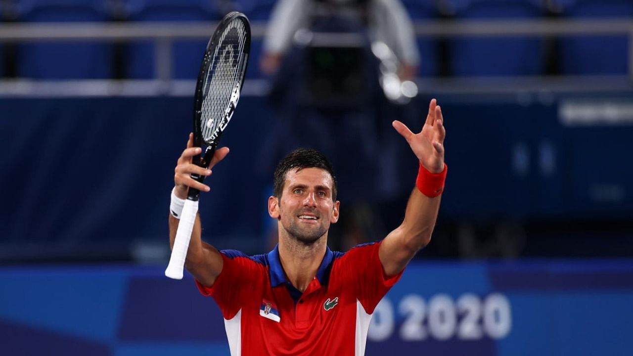 Novak Djokovic of Serbia celebrates after winning his quarterfinal match against Kei Nishikori of Japan. Credit: Reuters Photo