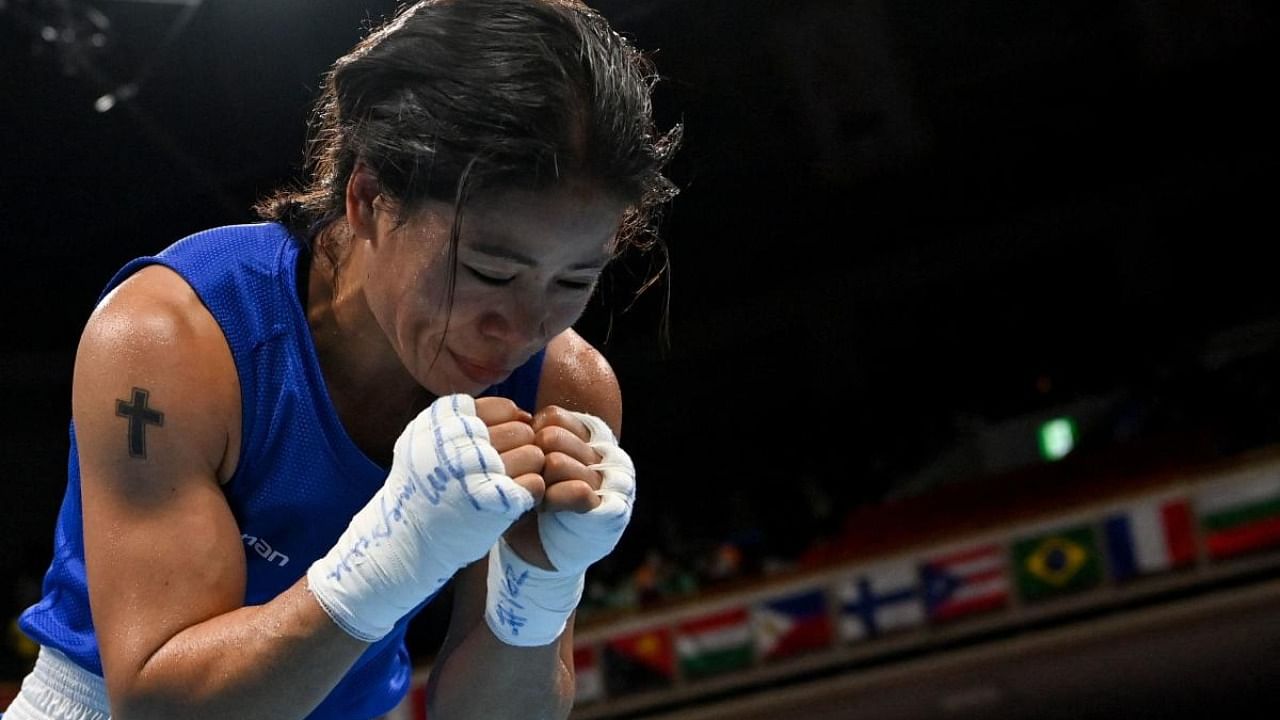 India's Chungneijang Mary Kom Hmangte reacts after losing against Colombia's Ingrit Lorena Valencia Victoria after their women's fly (48-51kg) preliminaries round of 16 boxing match during the Tokyo 2020 Olympic Games at the Kokugikan Arena in Tokyo. Credit: AFP Photo