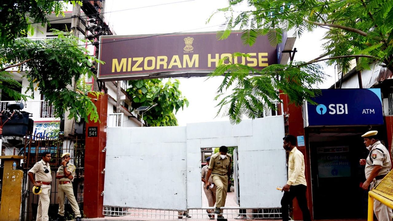 Assam security personnel stand vigil outside the Mizoram house in Guwahati. Credit: PTI Photo