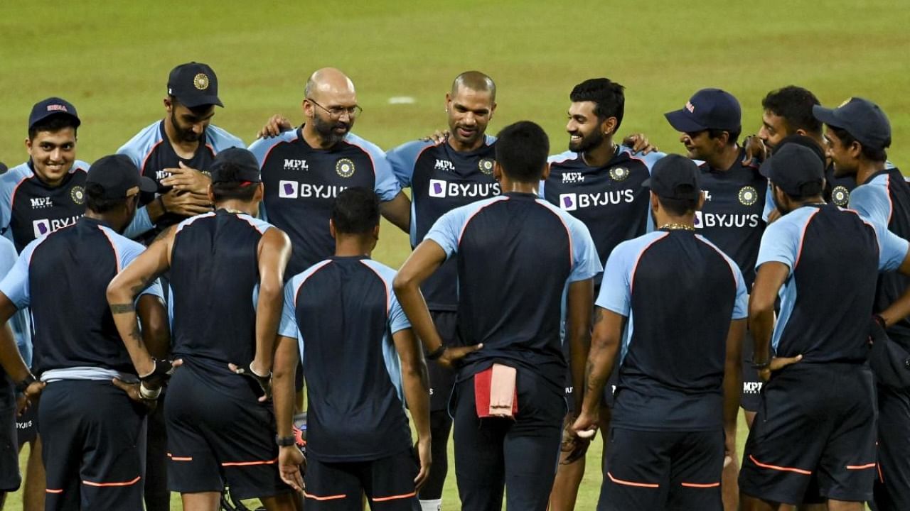 India's captain Shikhar Dhawan (C) chats with his teammates before the start of the third Twenty20 international cricket match between Sri Lanka and India at the R.Premadasa Stadium in Colombo on July 29, 2021. Credit: AFP Photo
