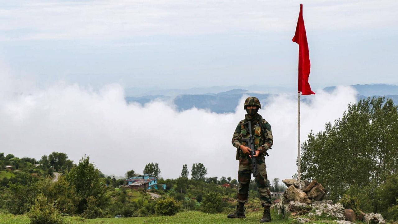 An Indian army soldier patrols along the Line of Control (LOC) between India and Pakistan border in Poonch district, Wednesday, July 14, 2021. Credit: PTI Photo