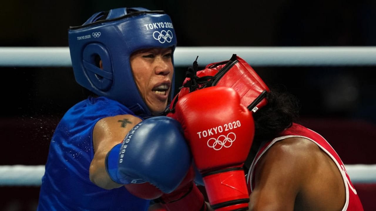 India's Mary Kom (L) during her bout against Ingrit Valencia of Columbia in women's Fly (48-51kg) boxing Round of 16, at the Summer Olympics 2020 in Tokyo, Thursday, July 29, 2021. Credit: PTI Photo