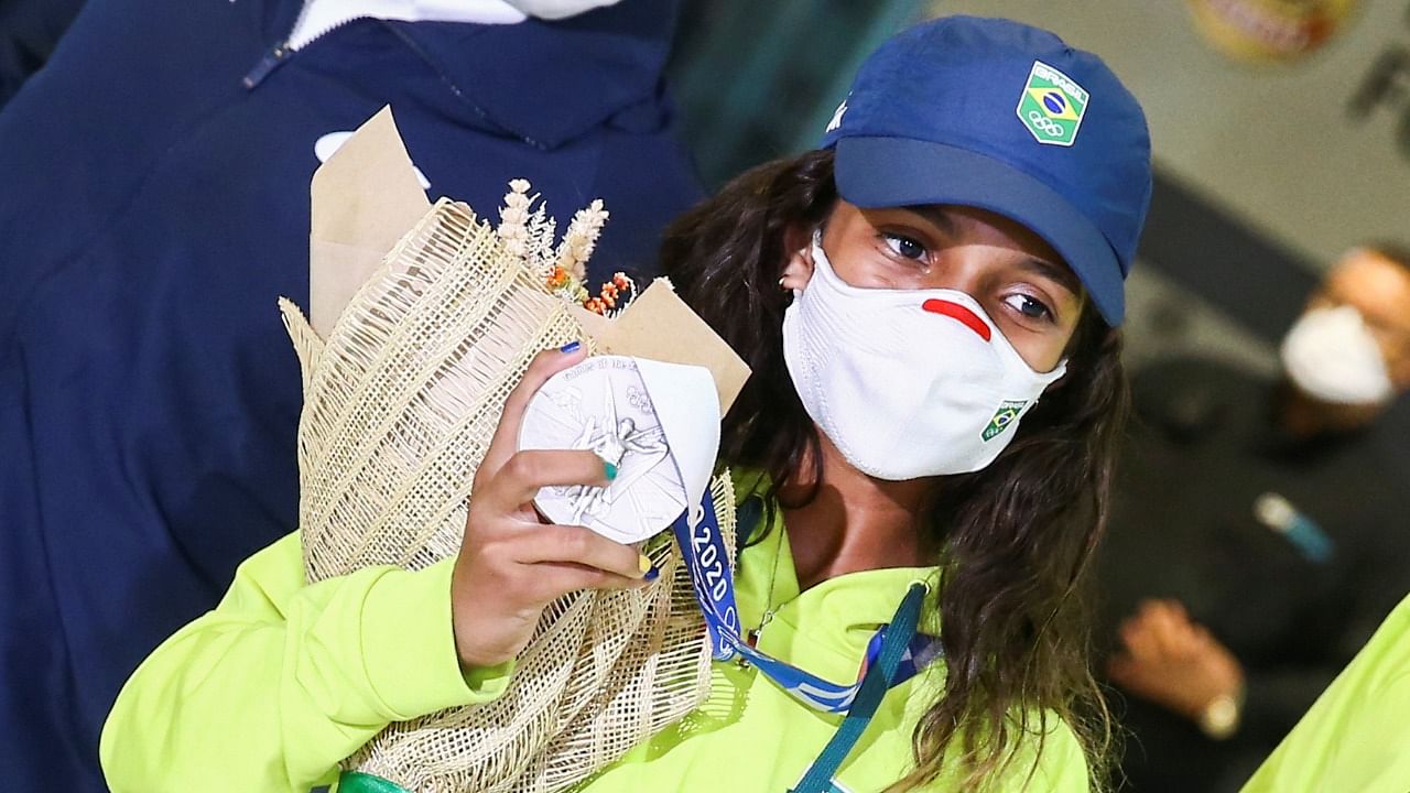 Brazilian skateboarder Rayssa Leal who won the silver medal at Tokyo 2020 Olympics, arrives at the Guarulhos International Airport. Credit: Reuters photo