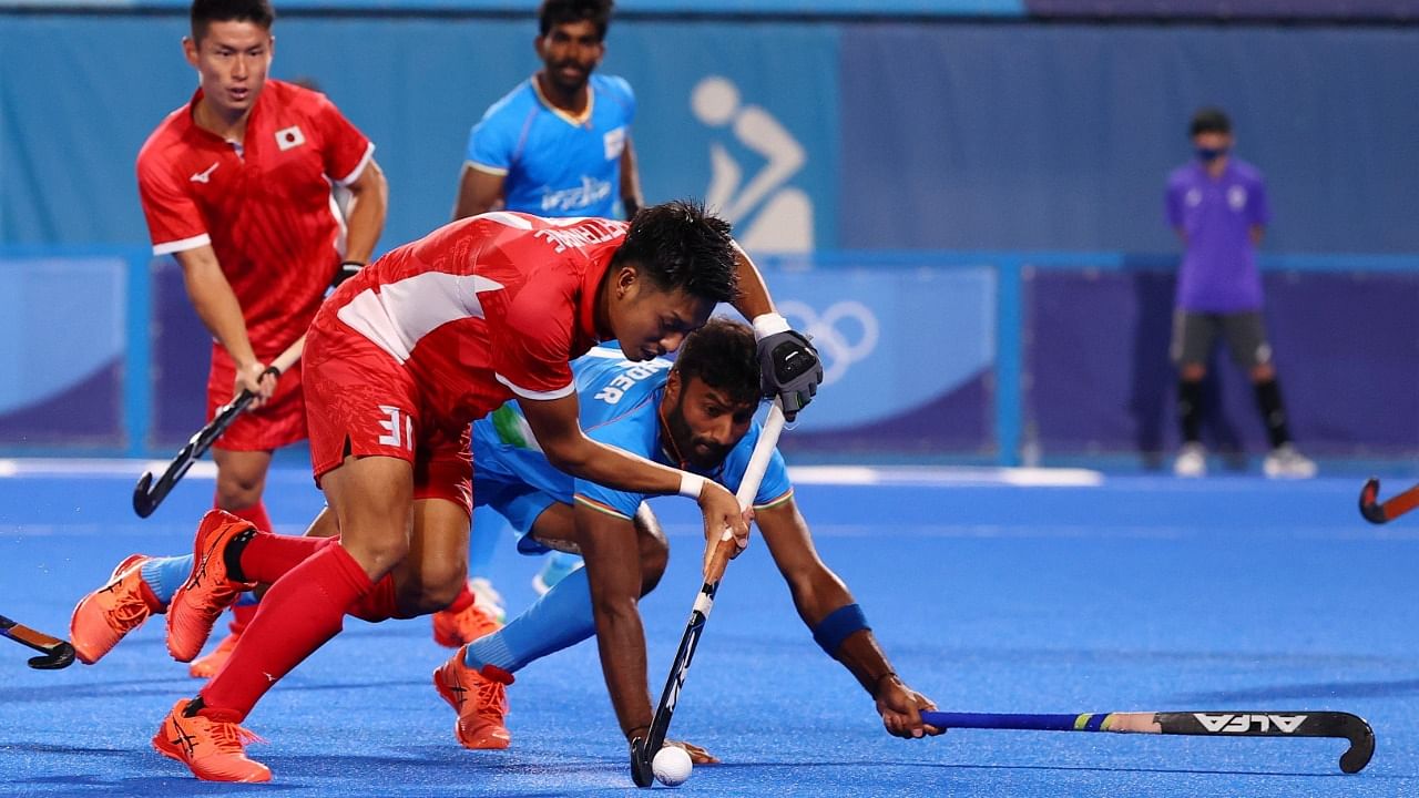 Kota Watanabe of Japan in action with Surender Kumar of India. Credit: Reuters Photo