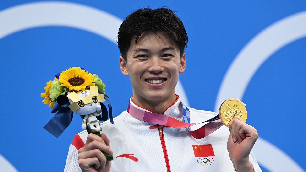 China's Wang Shun poses with his gold medal after the final of the men's 200m individual medley swimming event. Credit: AFP Photo