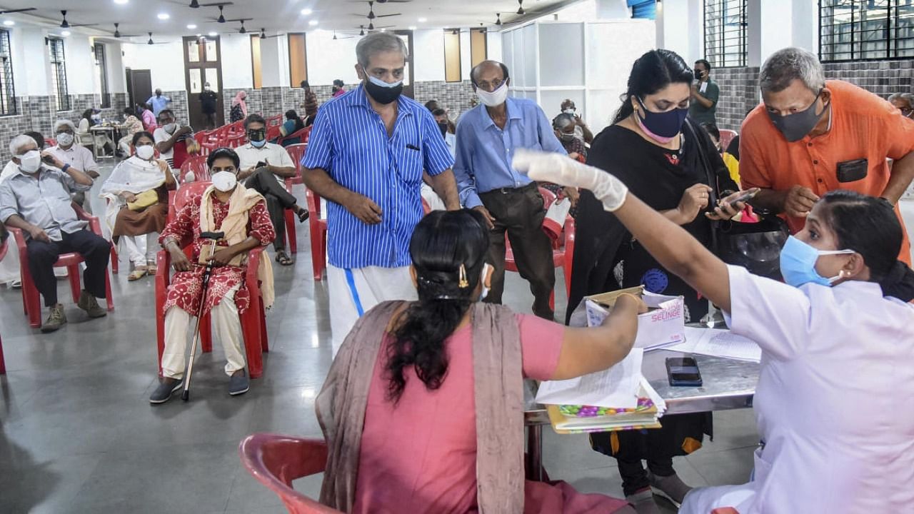 Beneficiaries wait to receive the Covid-19 vaccine dose at a vaccination centre in Kochi, Thursday, June 03, 2021. Credit: PTI File Photo