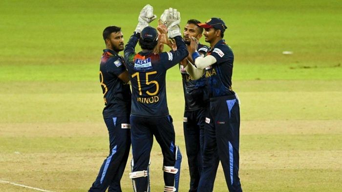 Sri Lanka's cricketers celebrates after the dismissal of India's Rahul Chahar (not pictured) during the third Twenty20 international cricket match between Sri Lanka and India at the R.Premadasa Stadium in Colombo. Credit: AFP Photo