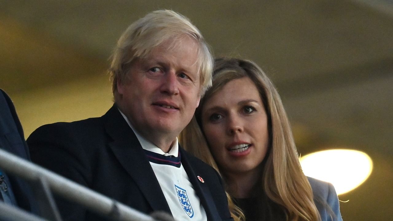 British Prime Minister Boris Johnson and his wife Carrie. Credit: Reuters File Photo
