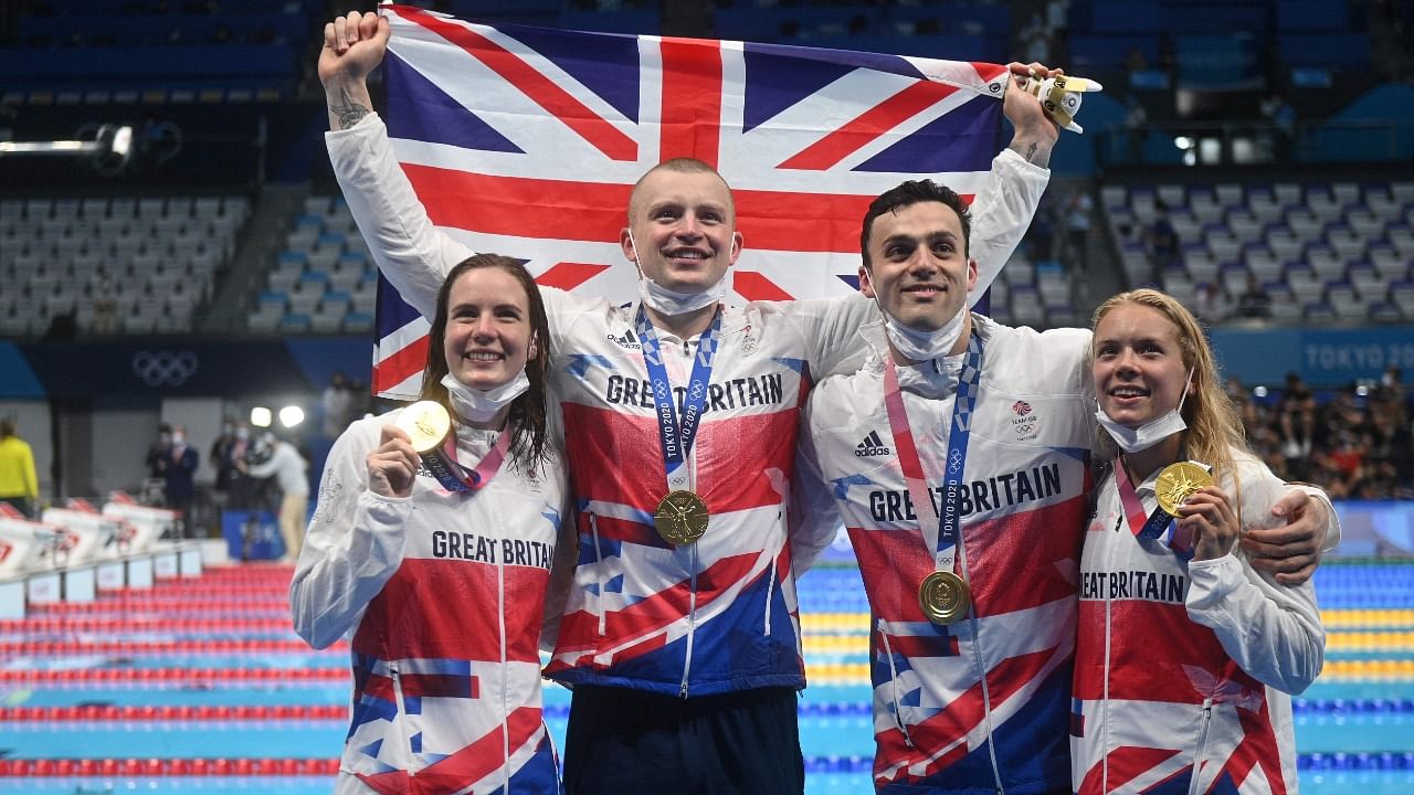 Britain's four-strong team of Kathleen Dawson, Peaty, James Guy and Anna Hopkin touched in 3min 37.58sec to break record. Credit: AFP Photo