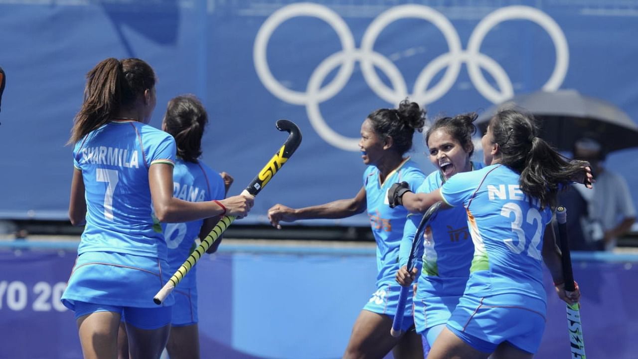  India's Vandana Katariya celebrates after scoring her hat-trick goal against South Africa during a women's field hockey match at the 2020 Summer Olympics, in Tokyo. Credit: PTI Photo