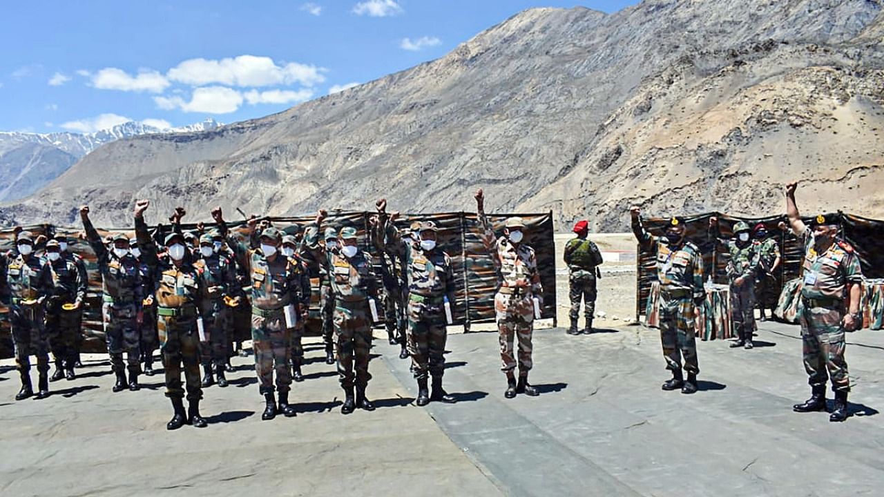 Chief of Defence Staff, General Bipin Rawat (R) interacts with troops during his visit to Line of Actual Control (LAC) near Sumdo. Credit: PTI Photo