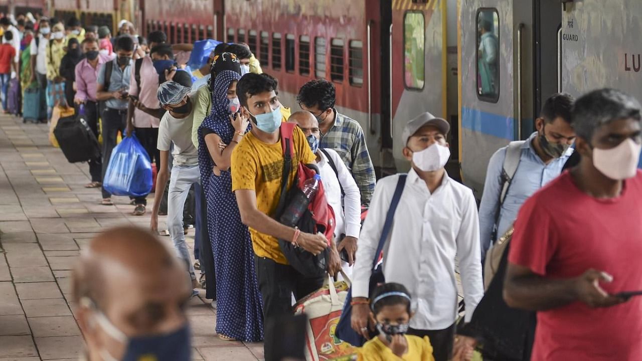 Passengers wait in a queue for their Covid-19 test, at a platform of Dadar railway station in Mumbai, Thursday, July 29, 2021. Credit: PTI Photo