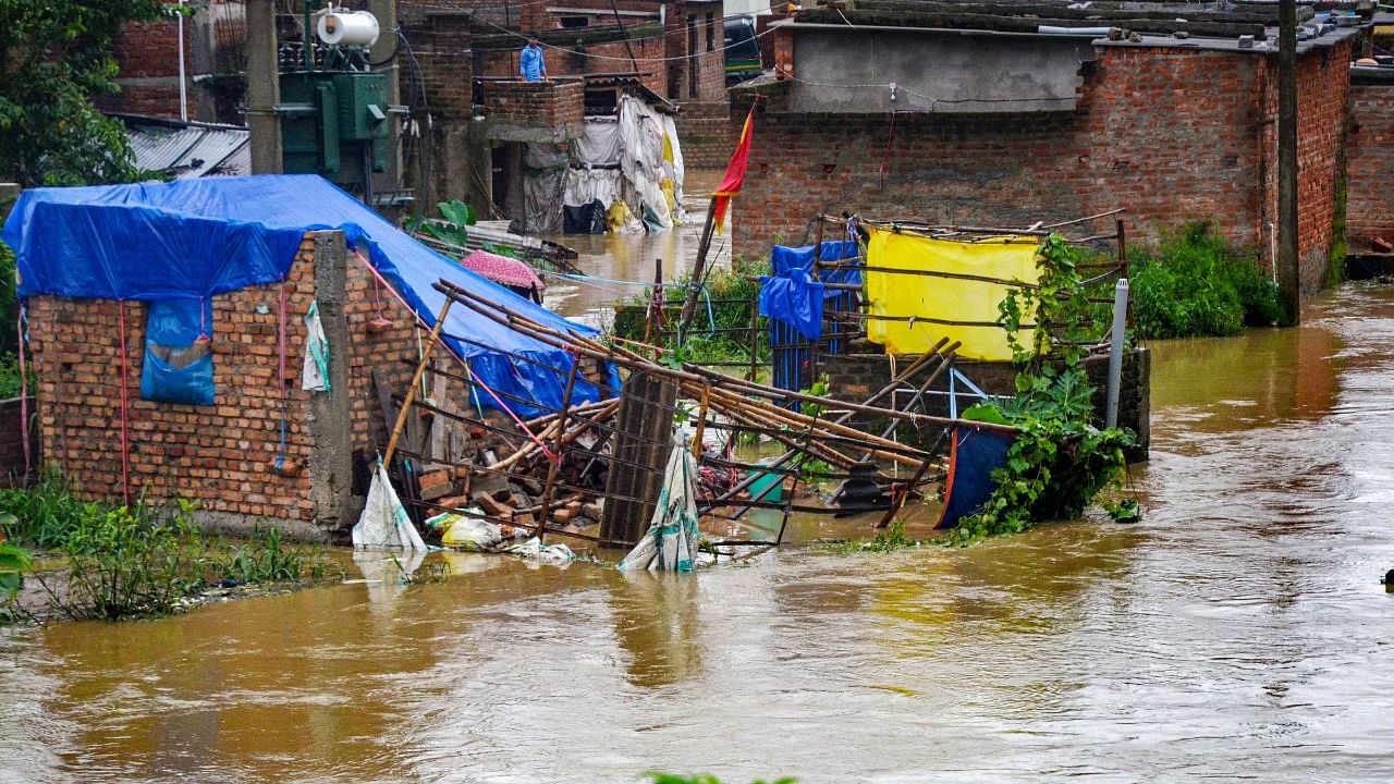A damaged house on a waterlogged street after heavy rain in Ranchi, Friday, July 30, 2021. Credit: PTI Photo