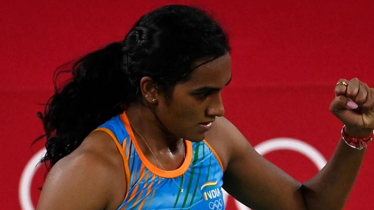 Sindhu reacts after a point against China's He Bingjiao in their women's singles badminton bronze medal match during the Tokyo 2020 Olympic Games at the Musashino Forest Sports Plaza in Tokyo on August 1, 2021. Credit: AFP Photo