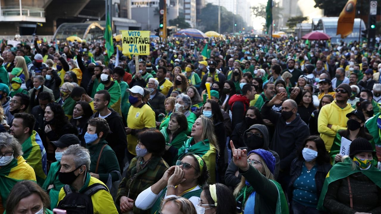 Supporters of Brazilian President Jair Bolsonaro take part in a protest calling for a printed vote, in Paulista Avenue, Sao Paulo. Credit: Reuters Photo