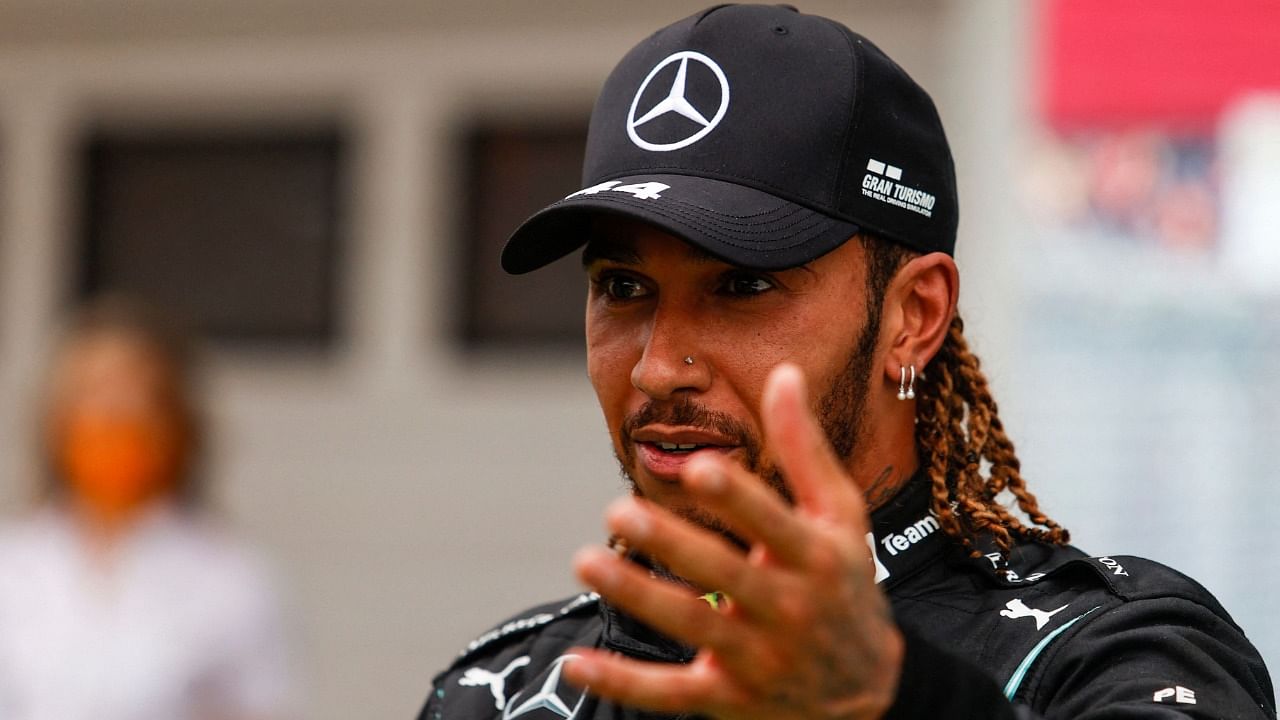 Mercedes' British driver Lewis Hamilton gives an interview after the Formula One Hungarian Grand Prix at the Hungaroring race track in Mogyorod near Budapest on August 1, 2021. Credit: AFP Photo