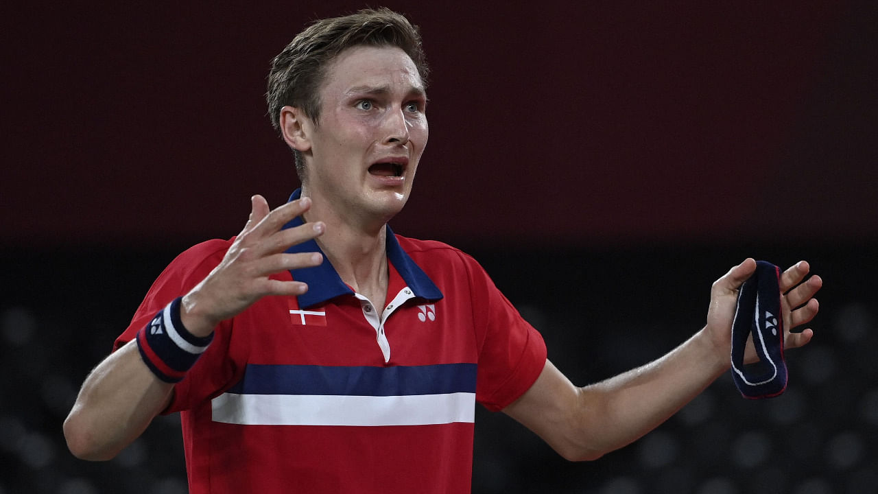 Denmark's Viktor Axelsen celebrates after beating China's Chen Long to win their men's singles badminton final match during the Tokyo 2020 Olympic Games. Credit: AFP Photo