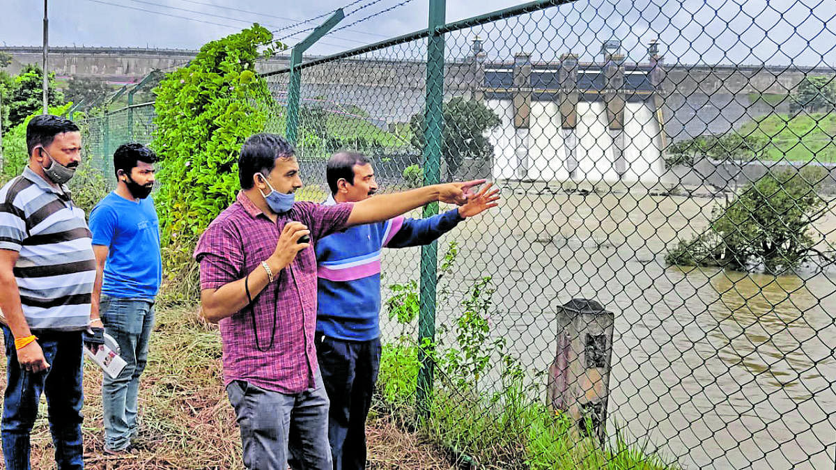 Expert Patanjali Bharadwaj inspects the site for the construction of a hanging bridge at Harangi reservoir.