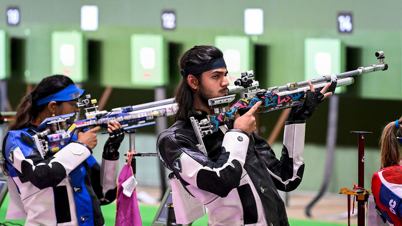 India's Elavenil Valarivan and Divyansh Singh Panwar compete in the 10m Air Rifle Mixed Team shooting event at the Summer Olympics 2020. Credit: PTI Photo