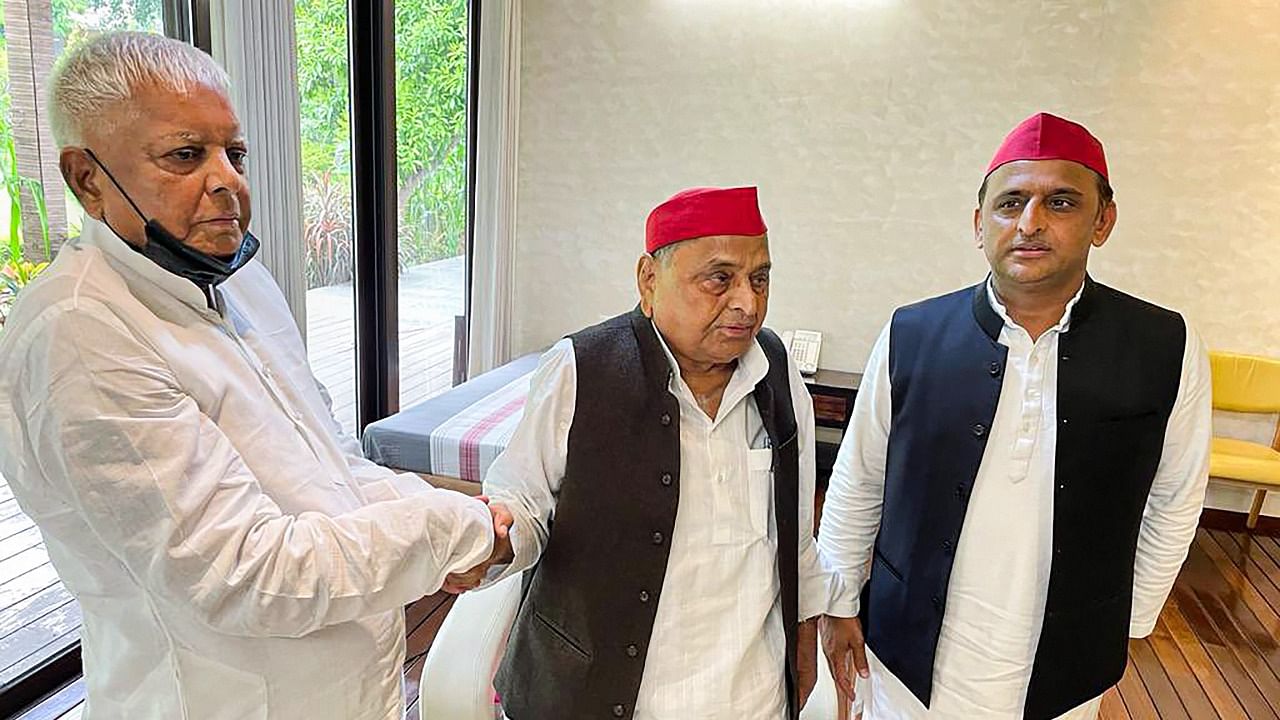 RJD supremo Lalu Prasad Yadav (L) with Mulayam Singh Yadav (C) and Akhilesh Yadav. Credit: PTI Photo