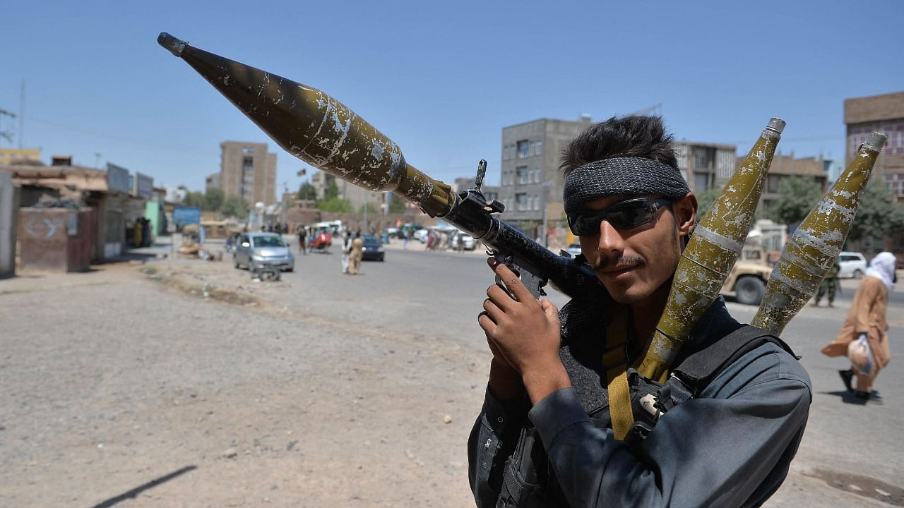 A policeman holds a rocket-propelled grenade (RPG) along a road in Herat on August 2, 2021. Credit: AFP Photo