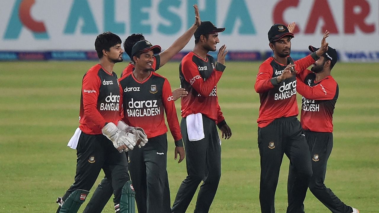 Bangladesh's cricketers celebrate their win in the first T20 international against Australia at the Sher-e-Bangla National Cricket Stadium in Dhaka. Credit: AFP Photo