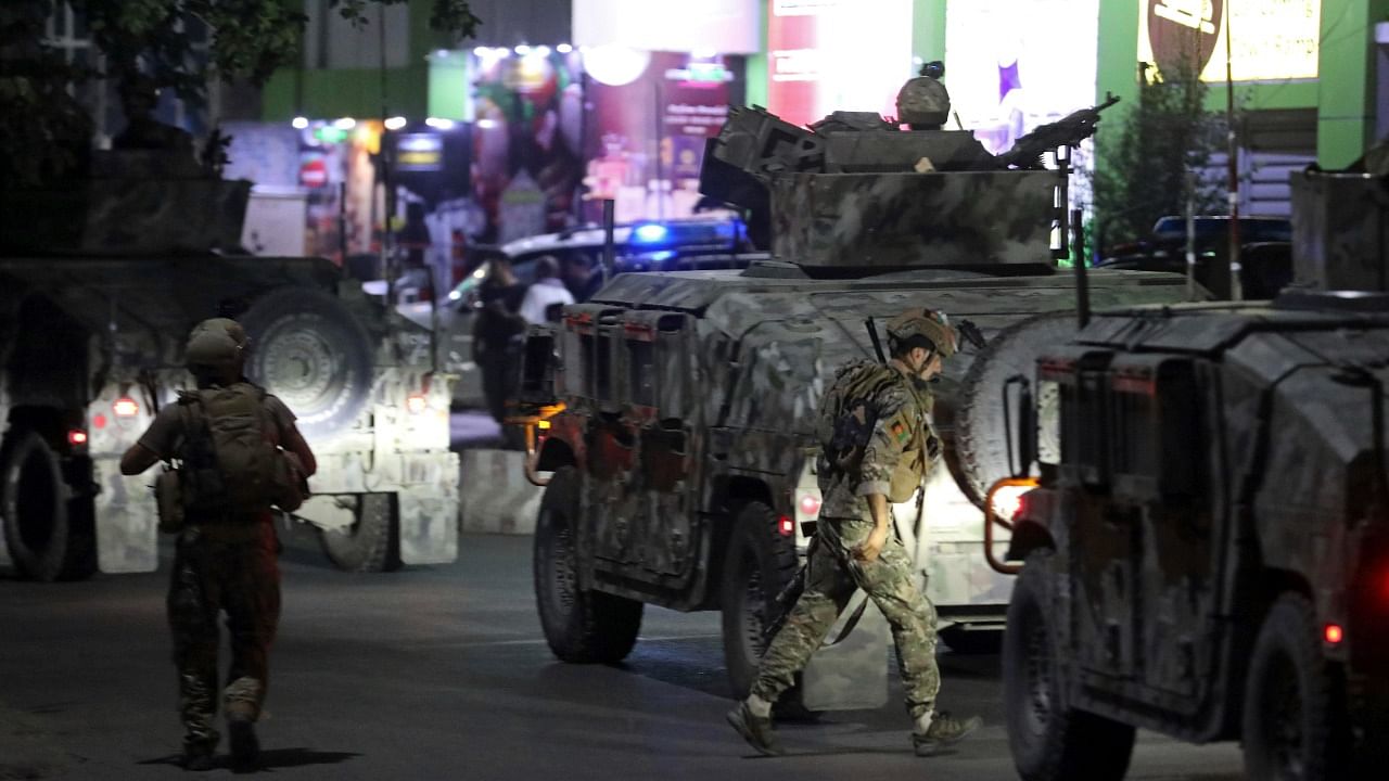 Afghan security personnel arrive at the site a powerful explosion in Kabul. Credit: AP Photo