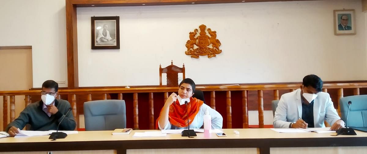 Deputy Commissioner Charulata Somal speaks at a meeting held in Madikeri on Monday.