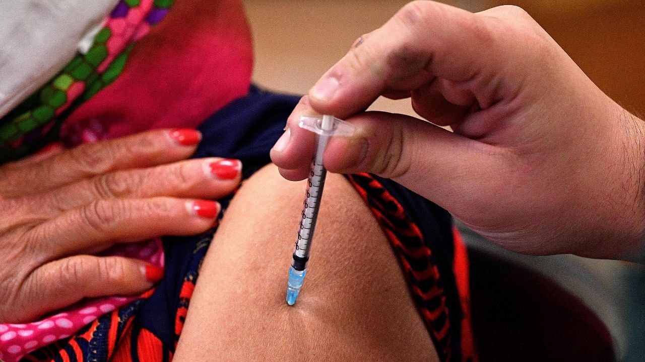 Covid vaccines are expected to reduce transmission among those with an asymptomatic breakthrough infection. Credit: AFP File Photo